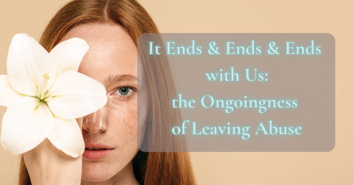 Redhead woman stares at camera while covering one eye with lily